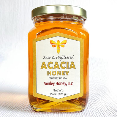 Glass jar of acacia honey