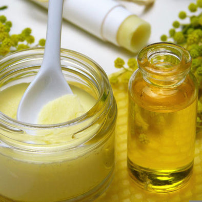 Homemade skincare products: cream, oil, and lip balm.