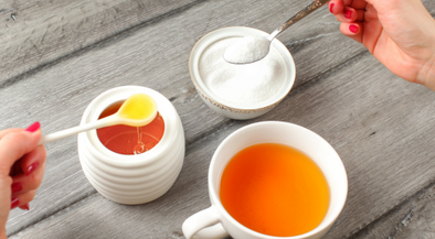 Deciding to put in sugar or honey in the tea