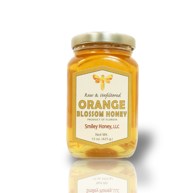 A jar of raw and unfiltered orange blossom honey.